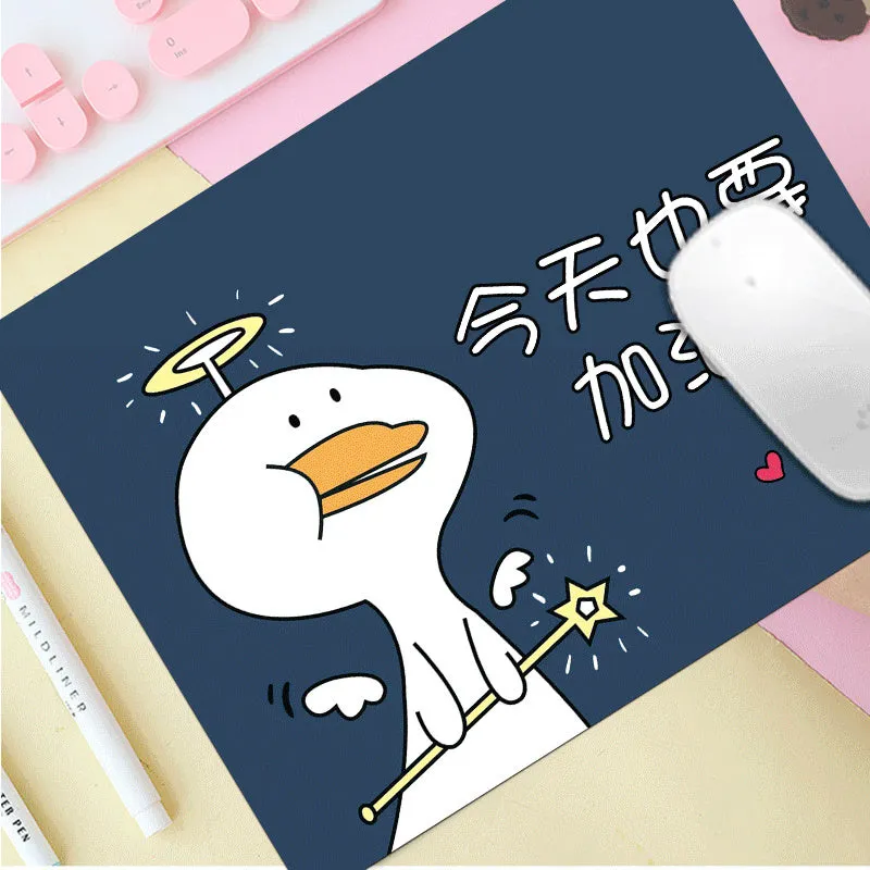Thick custom cartoon mouse pad with colourful design on a desk, showing black seam edge