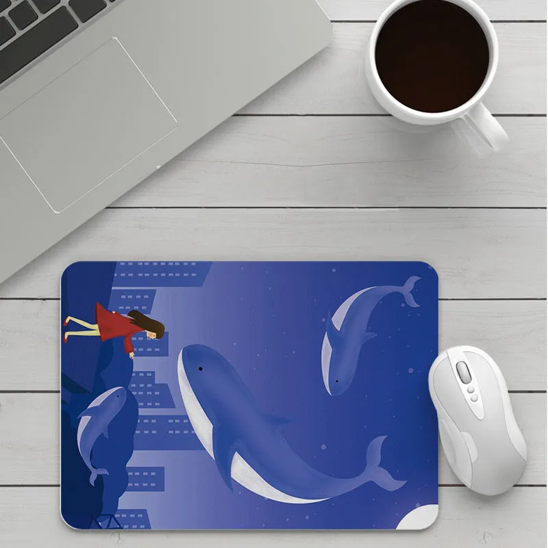 Thick custom cartoon mouse pad with colourful design on a desk, showing black seam edge