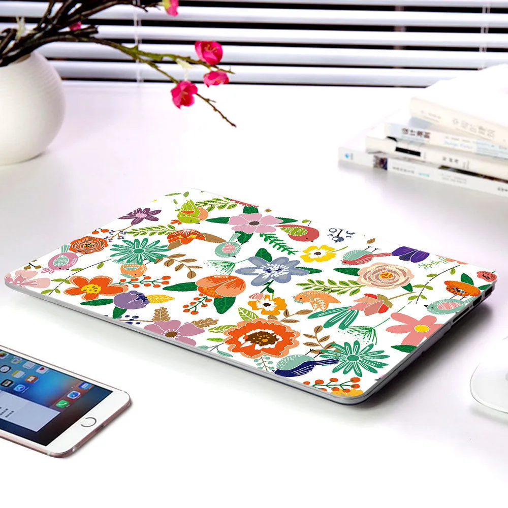 MacBook protective shell with floral pattern design covering laptop top and bottom surfaces