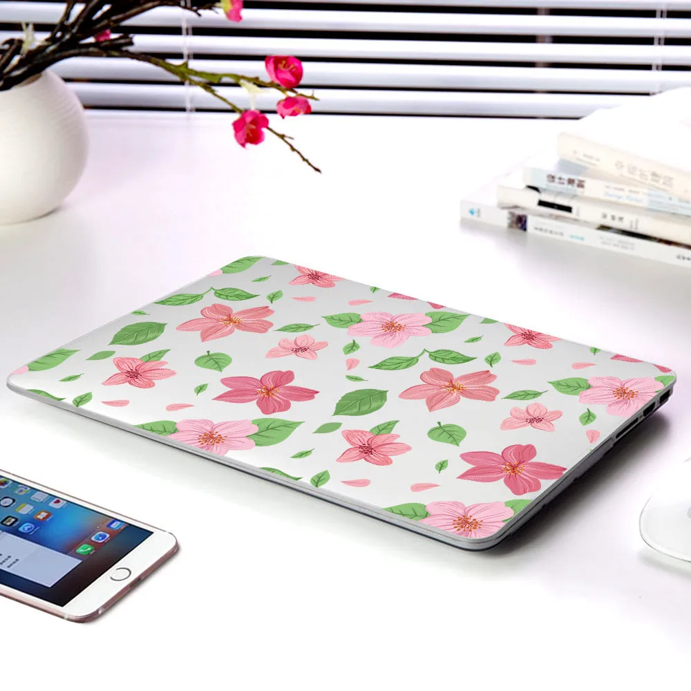 MacBook protective shell with floral pattern design covering laptop top and bottom surfaces