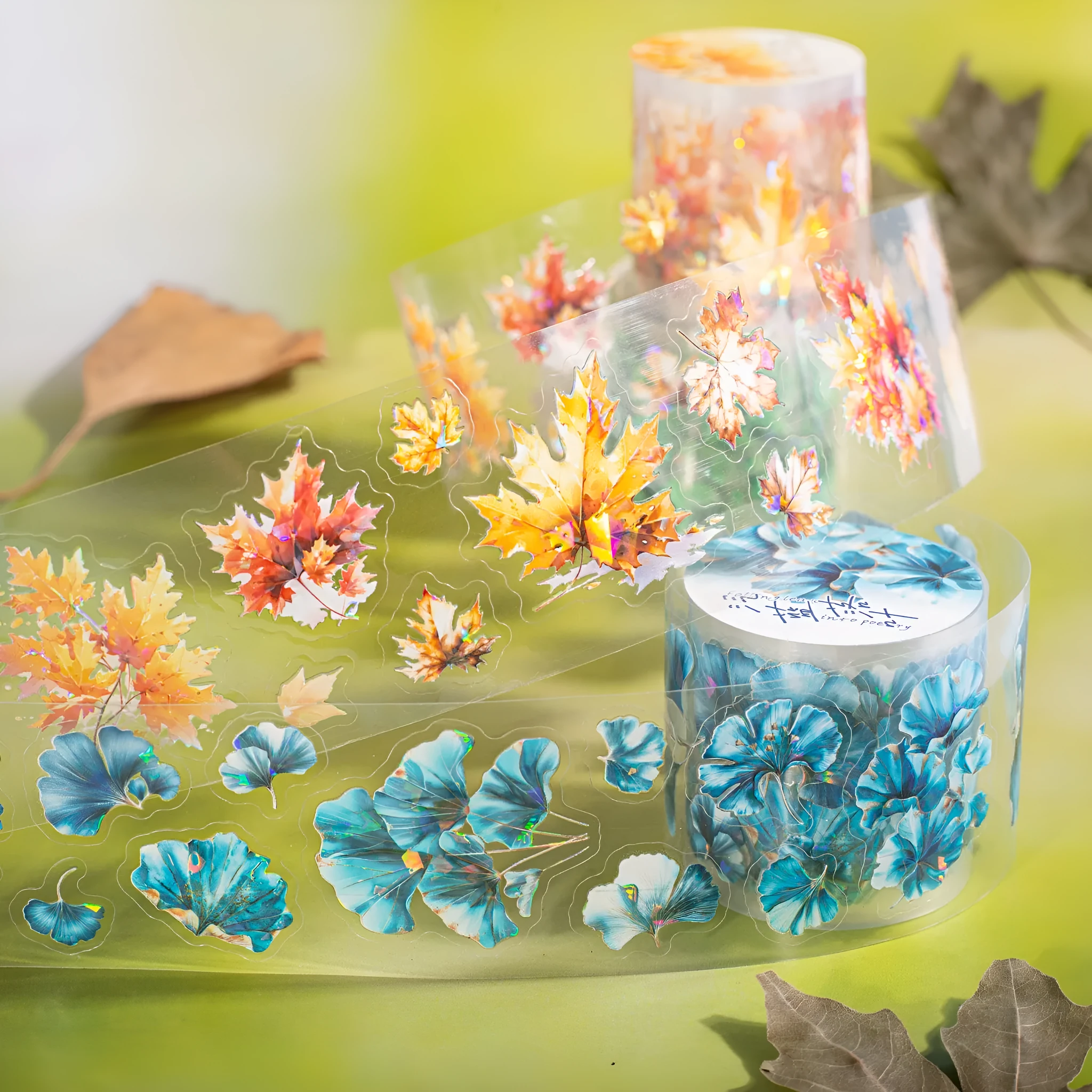 Roll of PET decorative stickers showing six leaf designs including ginkgo and maple, 40mm wide and 2m long.