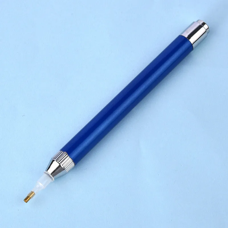 Blue luminous aluminium alloy drill pen for diamond painting and cross stitch crafts on a dark surface.