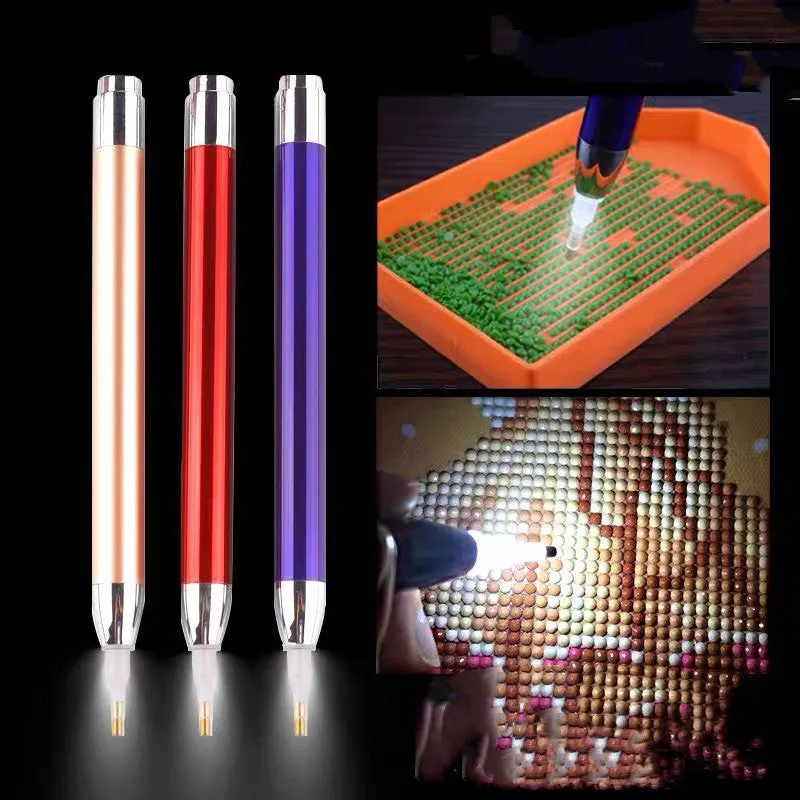 Blue luminous aluminium alloy drill pen for diamond painting and cross stitch crafts on a dark surface.