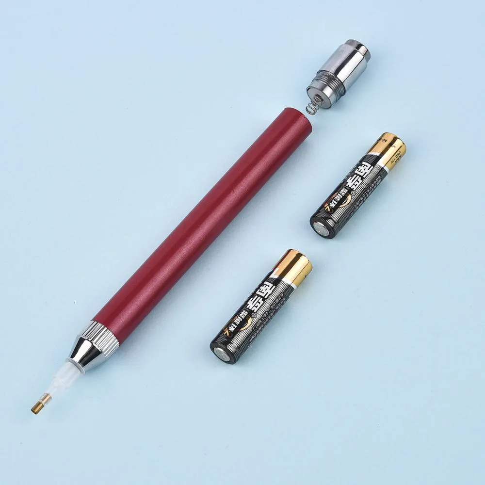 Blue luminous aluminium alloy drill pen for diamond painting and cross stitch crafts on a dark surface.