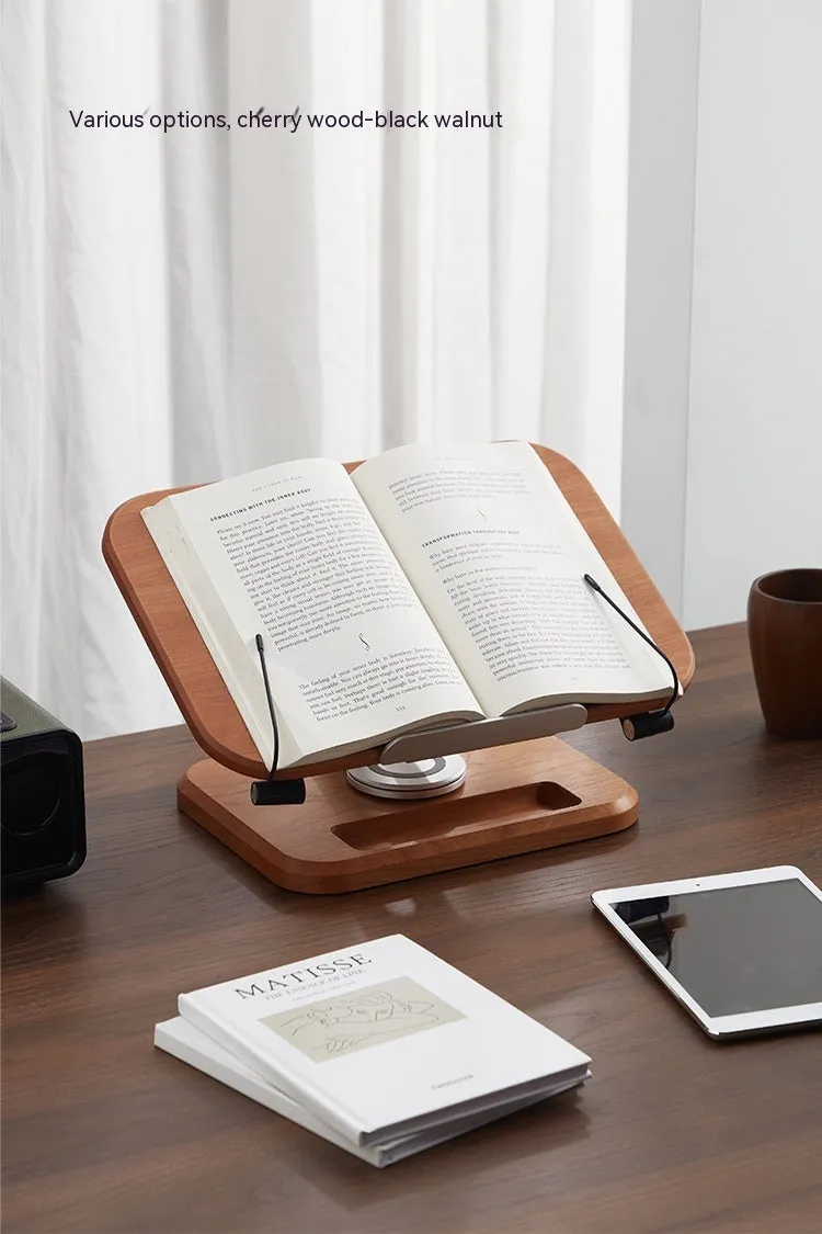 Adjustable walnut-coloured solid wood reading rack holding a book at an angle.