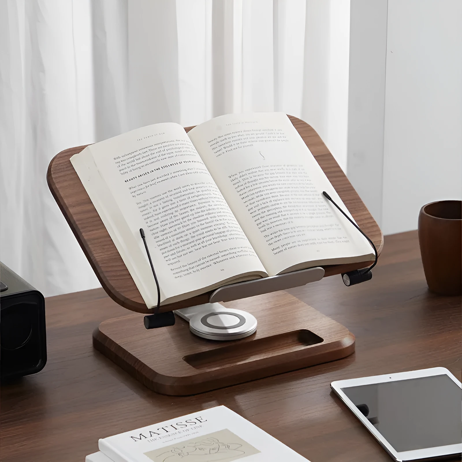 Adjustable walnut-coloured solid wood reading rack holding a book at an angle.
