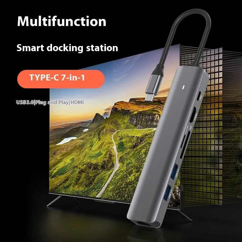 Silver 7-in-1 USB-C laptop hub showing HDMI, USB-C PD, USB 3.0, and SD card ports