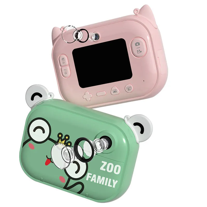 Blue digital printing camera with 2.4-inch screen showing image preview, alongside printed photo and accessories
