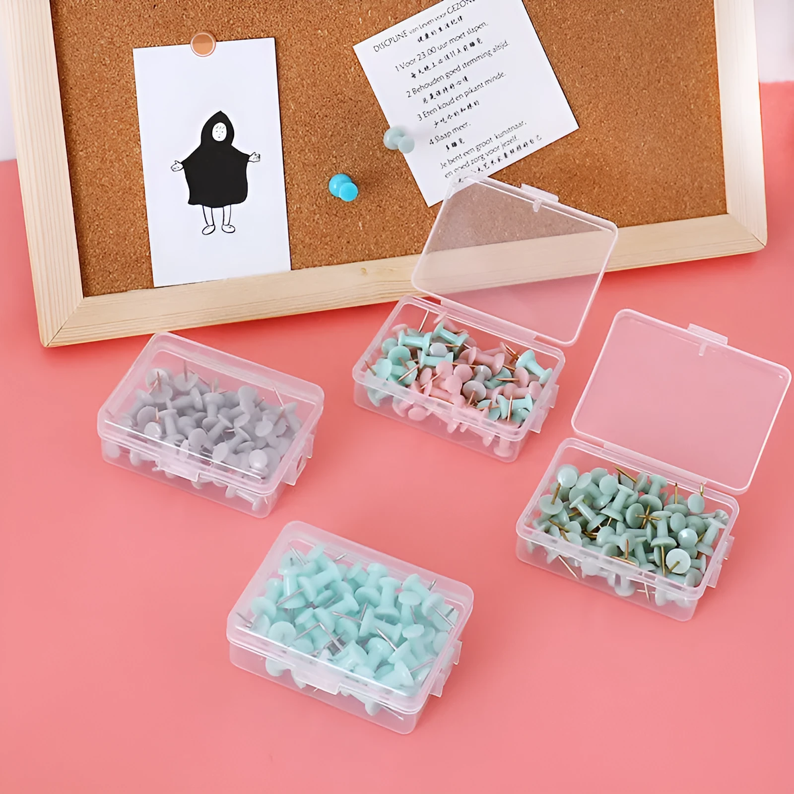 50 Morandi colour push pins with five-pointed star heads on a cork board