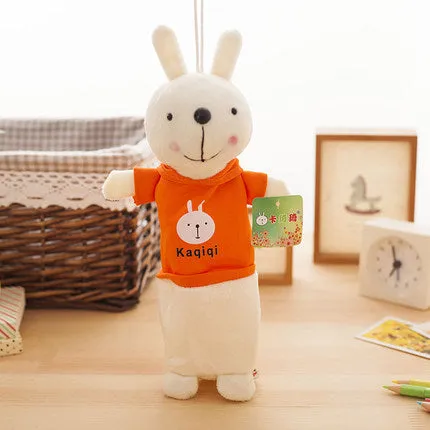 Soft plush rabbit-shaped pencil case in assorted colours, shown with pens inside.