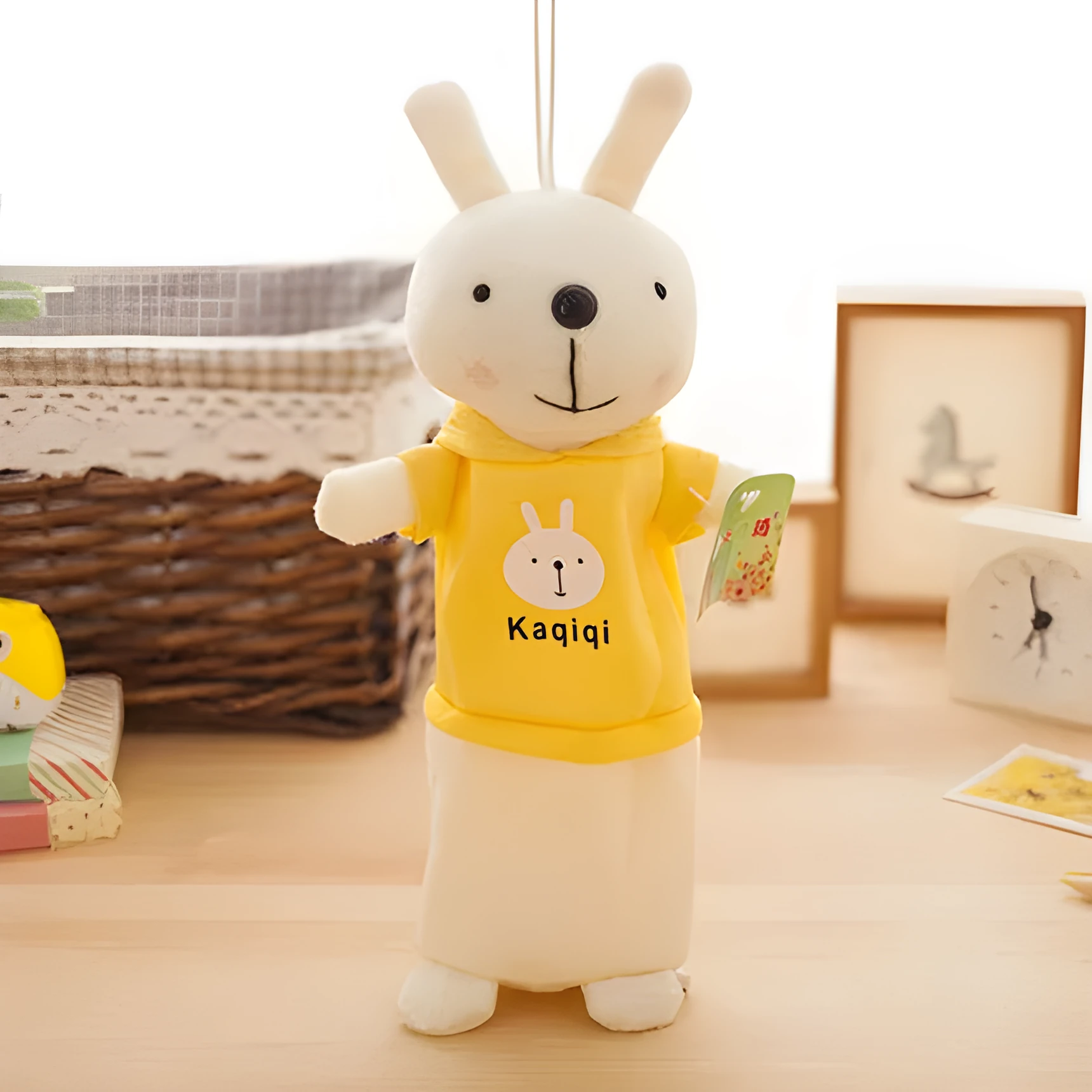 Soft plush rabbit-shaped pencil case in assorted colours, shown with pens inside.