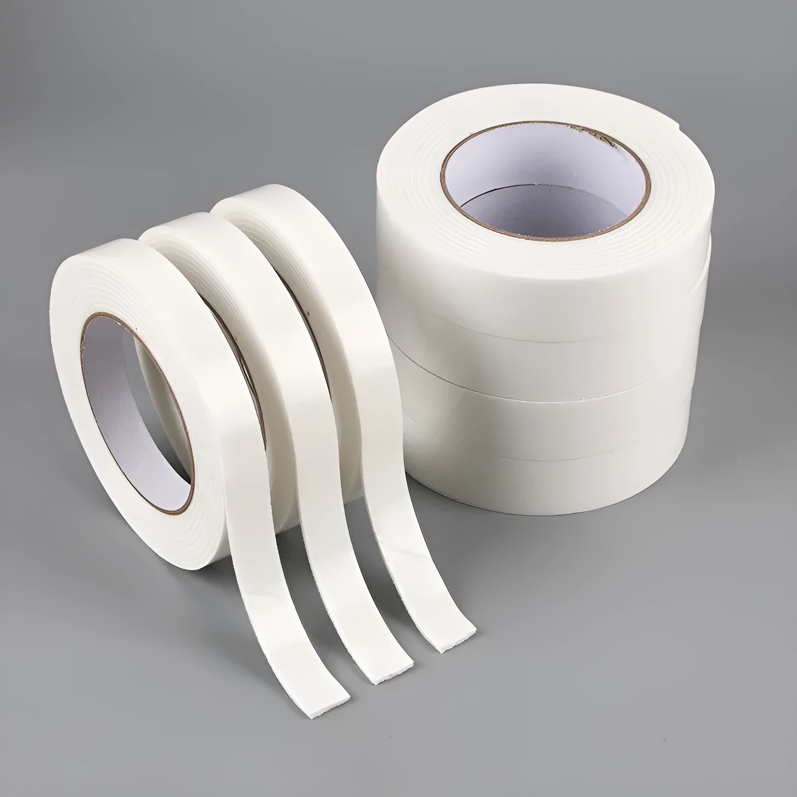 Roll of 3mm thick foam double-sided adhesive tape showing sponge core, with size options 15mm, 18mm, and 30mm wide.