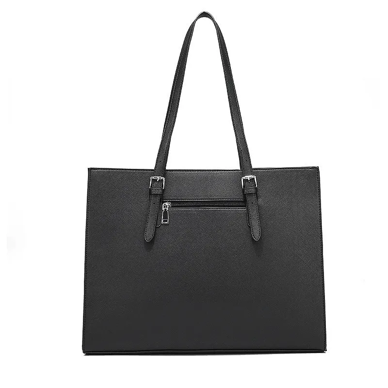 Large black women's business shoulder bag showing computer compartment and three adjustable straps