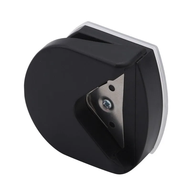 Black plastic and metal business card corner cutter on a white background.