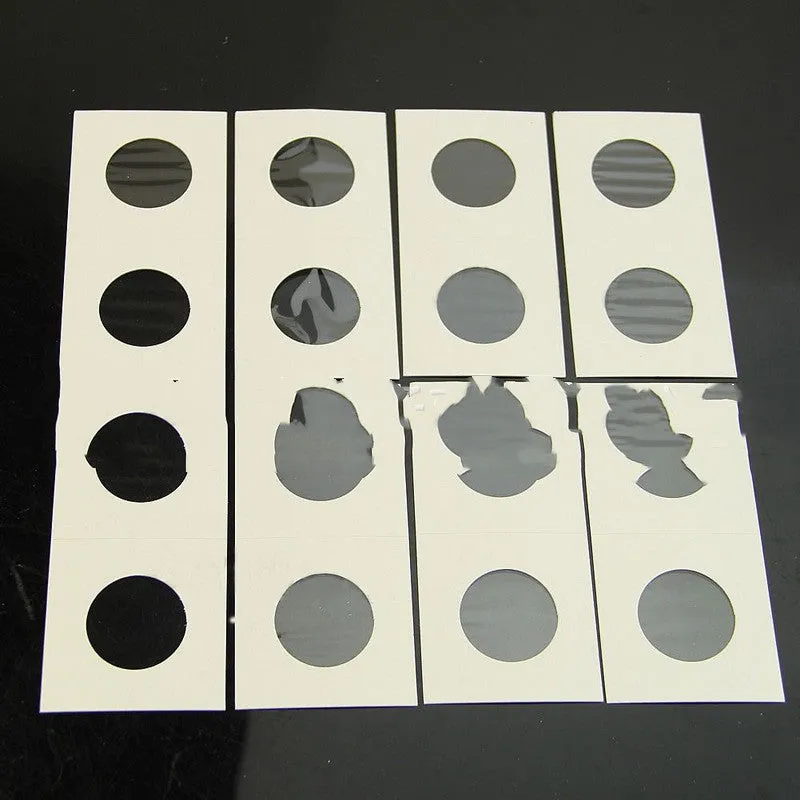 Set of 50 white paper coin protector clips for commemorative coins in a transparent OPP bag.